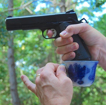 Holding-a-handgun-with-a-cup-and-saucer-grip-401x400.jpg